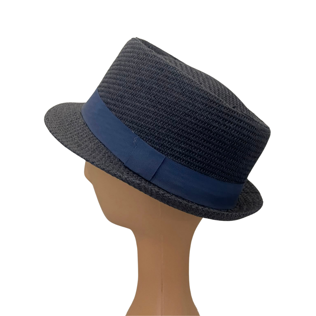 A dark gray woven fedora hat with a navy blue band, displayed on a tan mannequin head against a plain white background.