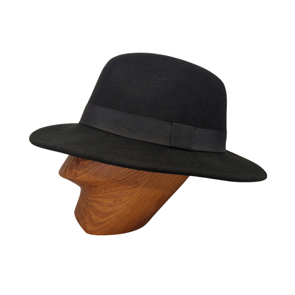A black felt fedora hat with black ribbon band displayed on a wooden mannequin head against a plain white background. Side