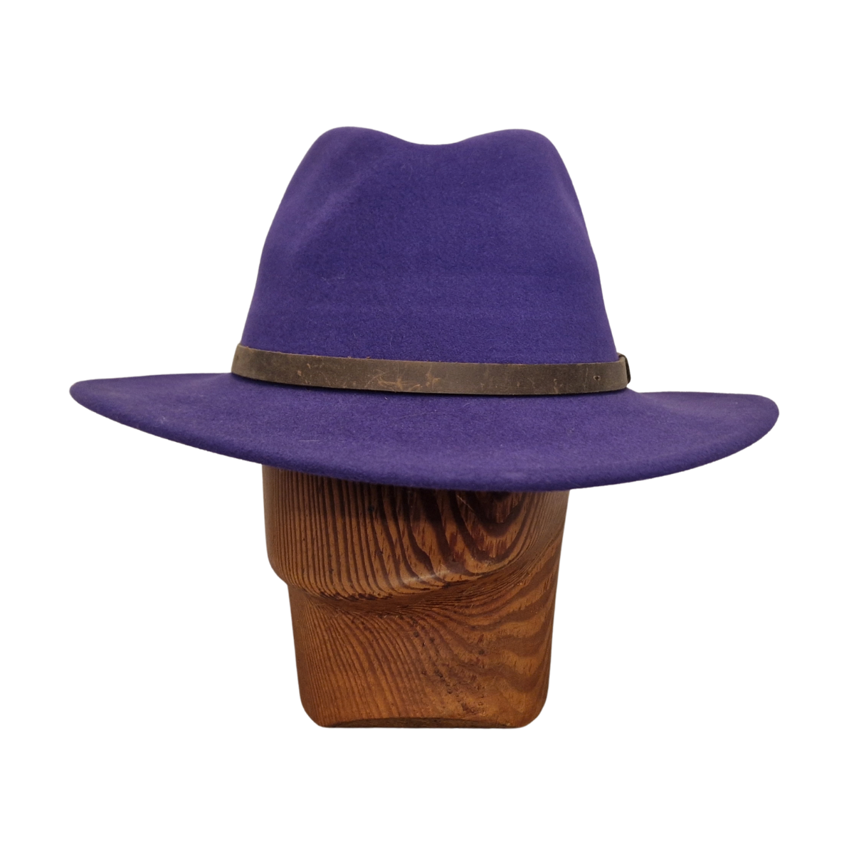 A purple felt wide-brim fedora hat with a dark brown band, displayed on a wooden mannequin head against a plain white background. Front