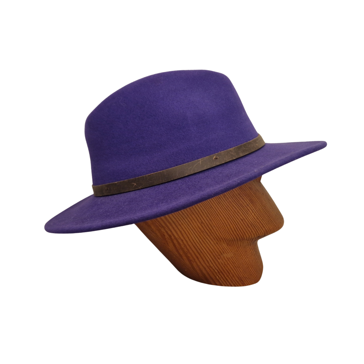 A purple felt wide-brim hat with a dark brown leather band, displayed on a brown ribbed mannequin head against a plain white background. Side