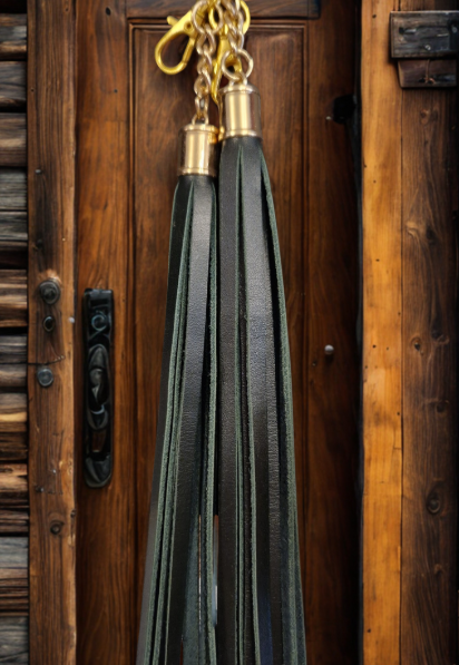 Racing green handmade leather boot tassel hanging up
